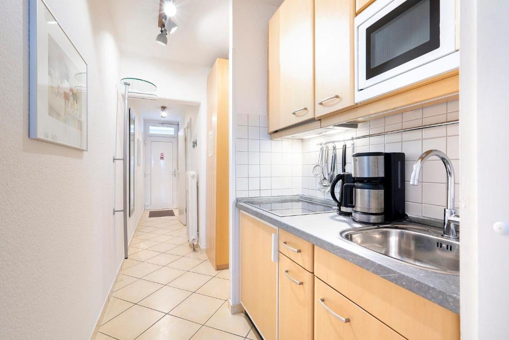 Kuchyň nebo kuchyňský kout v ubytování Grömitz-Center Whg 7
