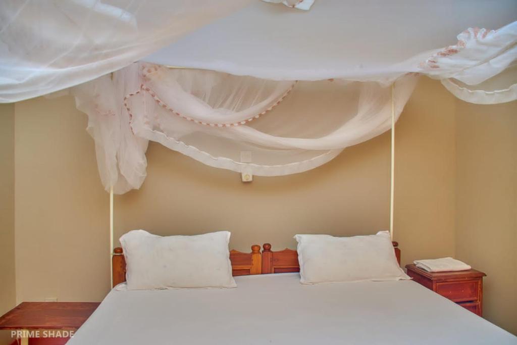 Postel nebo postele na pokoji v ubytování PRIMESHADE GUESTHOUSE