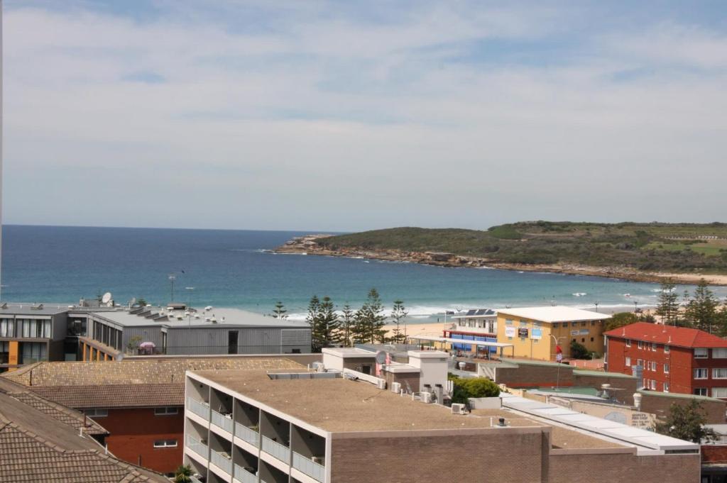 a view of a city with a beach and buildings at Seaside Serenity - Stunning Beach Views in Maroubra in Sydney
