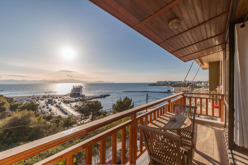 a balcony with a view of the ocean at CALDERA close to the port, airport & Athens in Rafina