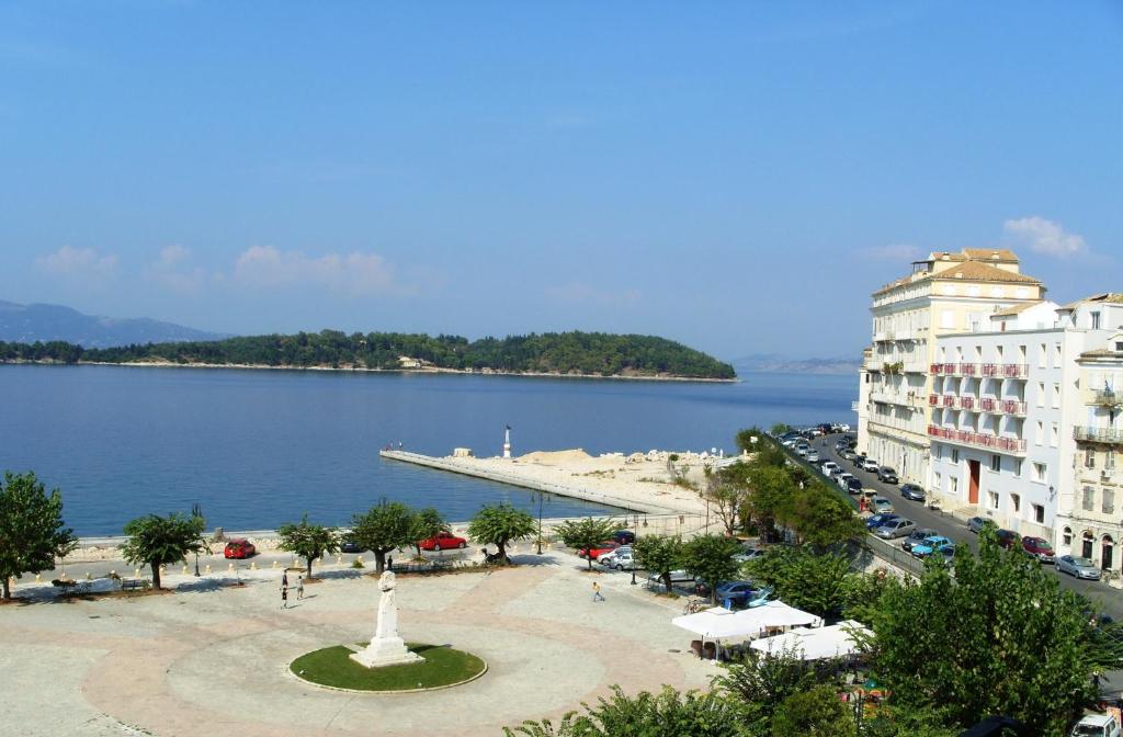a view of a large body of water next to buildings at Konstantinoupolis in Corfu