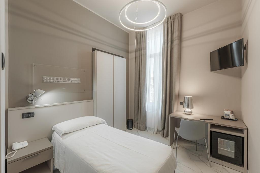 Postel nebo postele na pokoji v ubytování Hotel Villa Levi