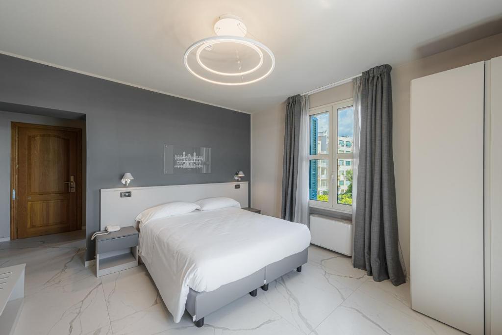 Postel nebo postele na pokoji v ubytování Hotel Villa Levi
