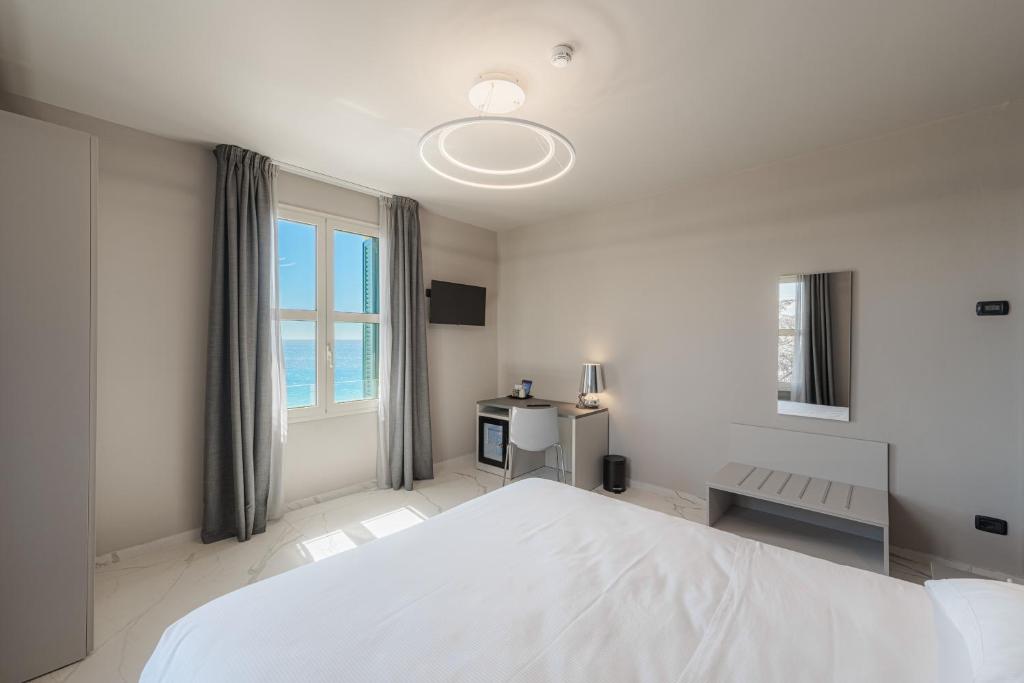 Postel nebo postele na pokoji v ubytování Hotel Villa Levi