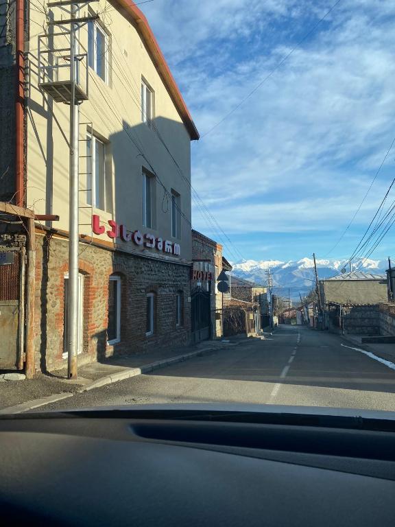 a view from a car of an empty street at Hotel Tao in Telavi