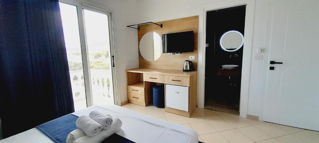 TV a/nebo společenská místnost v ubytování Hotel Villa Ambra