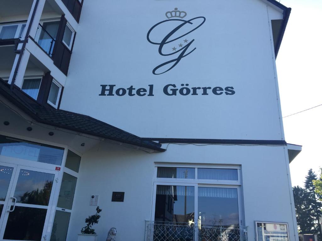 a building with a sign for a hotel at Hotel Görres in Wachtberg