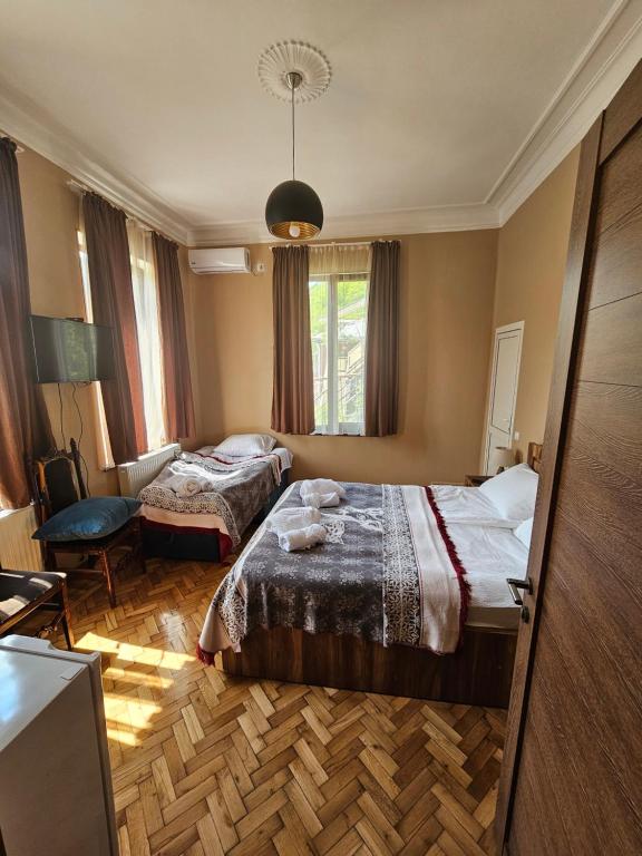 Postel nebo postele na pokoji v ubytování Shota's Guest House