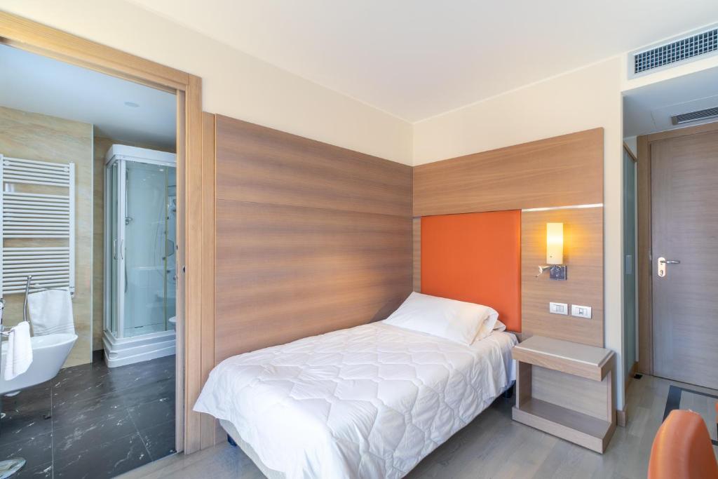 Postel nebo postele na pokoji v ubytování Hotel Villa Doimo