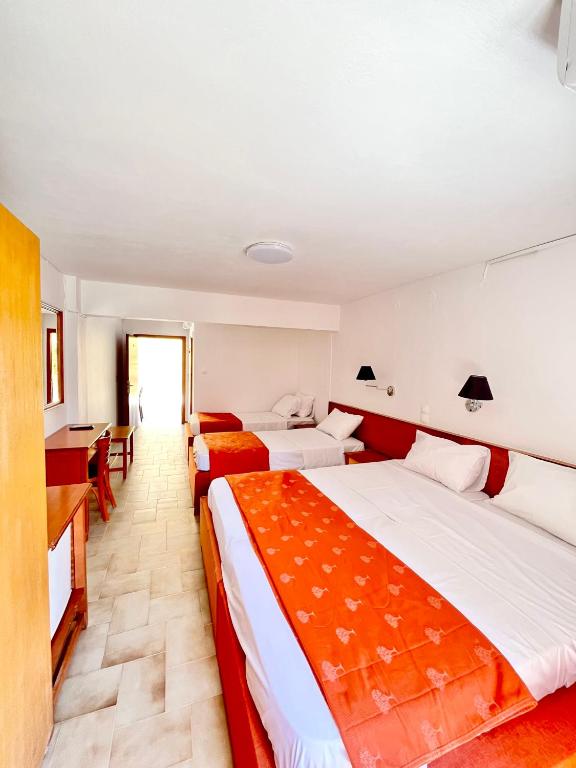 Postel nebo postele na pokoji v ubytování Oelia Rooms & Apartments