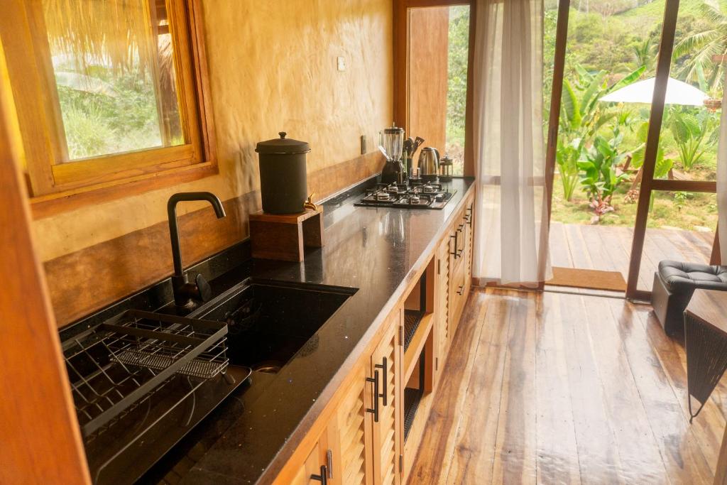 Kuchyň nebo kuchyňský kout v ubytování Cabañas con Jacuzzi, Tayrona vía Palomino - Villa Puy