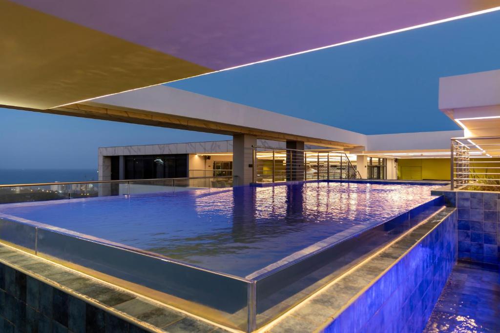 an infinity pool on the roof of a house at Coastlands Skye Hotel, Ridgeside, Umhlanga in Durban