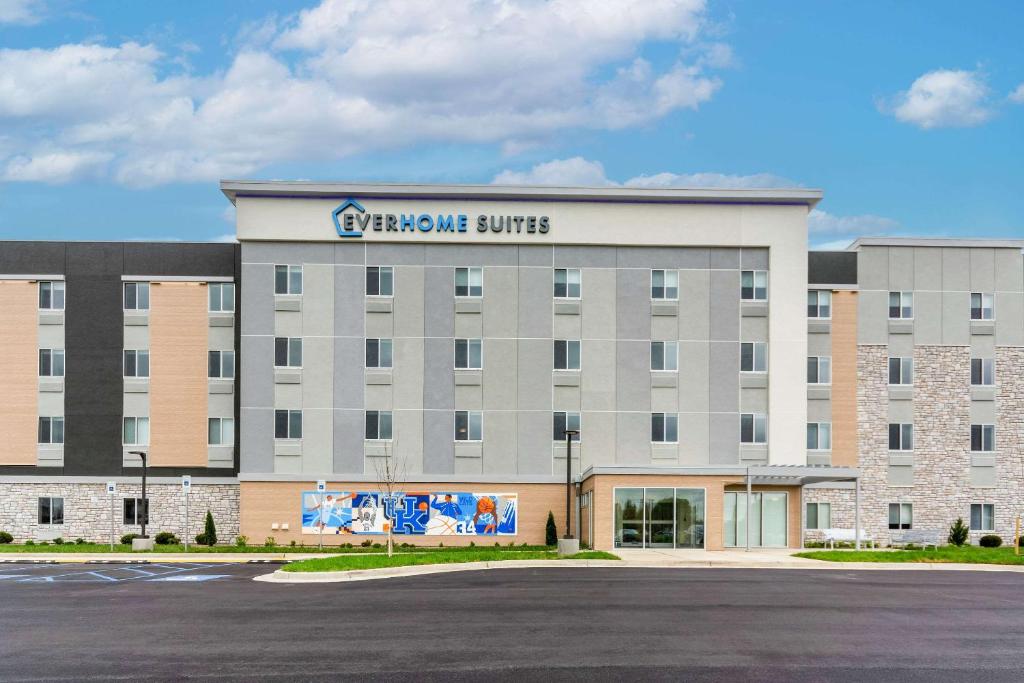 a large building with a sign that reads geneva office at Everhome Suites Lexington North in Lexington