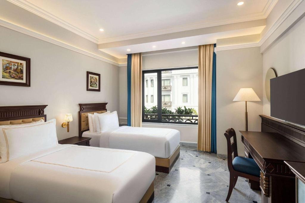 Кровать или кровати в номере Ramada by Wyndham Goa Vagator