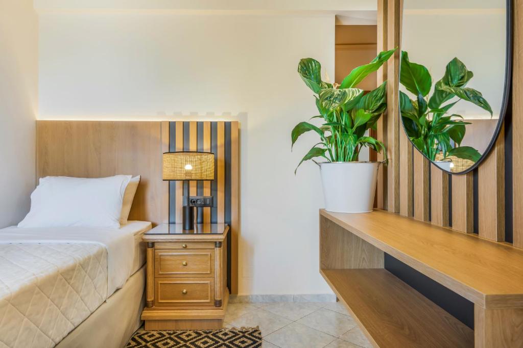 Postel nebo postele na pokoji v ubytování Socrates Hotel Malia Beach