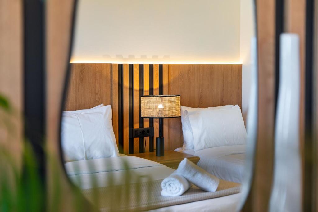 Postel nebo postele na pokoji v ubytování Socrates Hotel Malia Beach