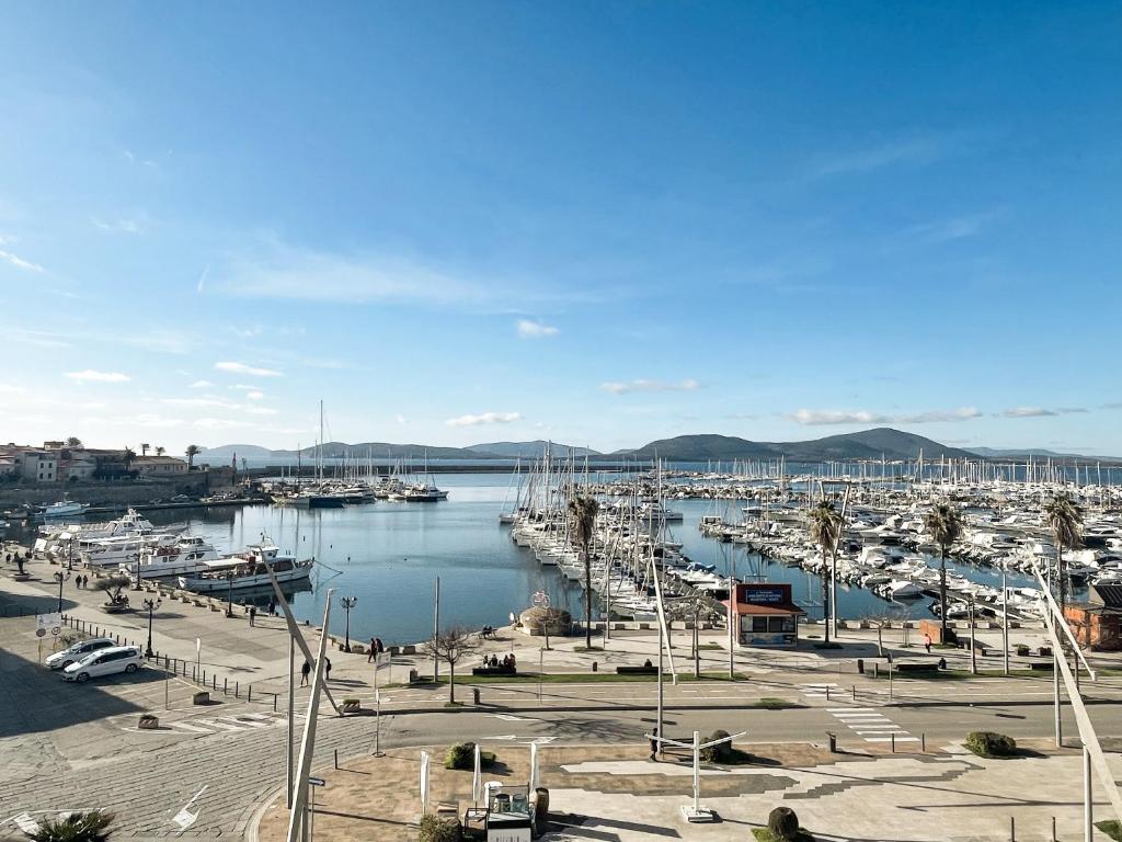 a marina with alot of boats in the water at Archi di mare - superba vista mare, centralissimo in Alghero