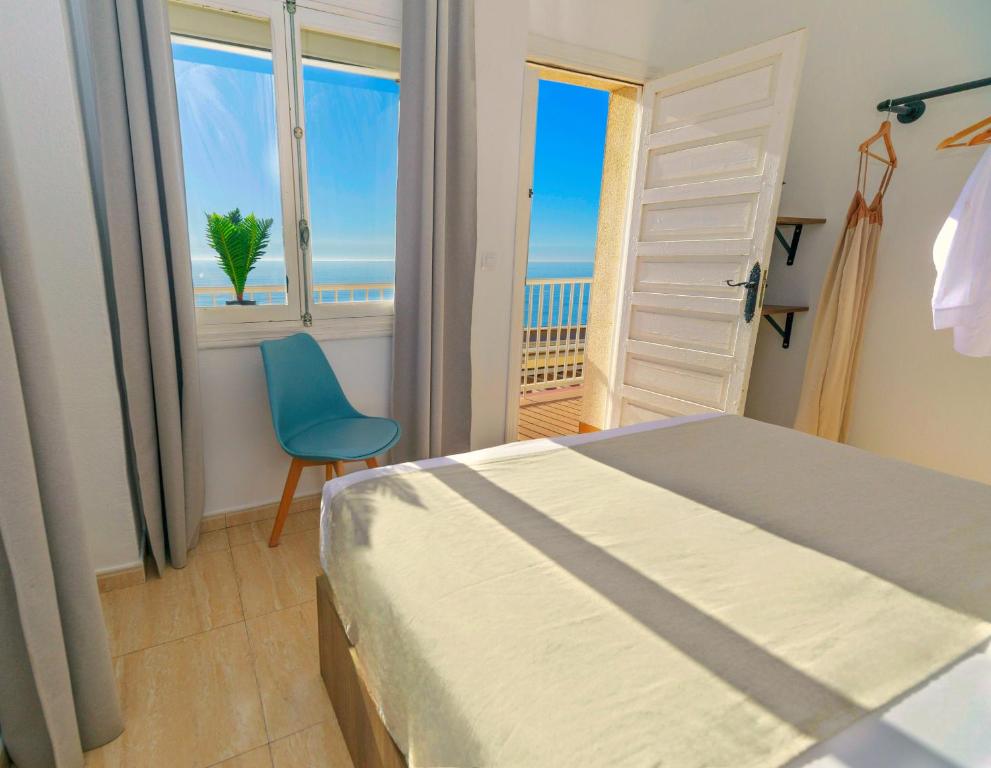Postel nebo postele na pokoji v ubytování Maxcaly Playa
