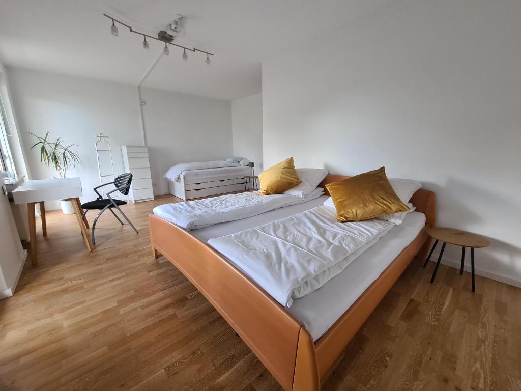 a bedroom with a bed and a desk in it at Wolke7 in Erbach