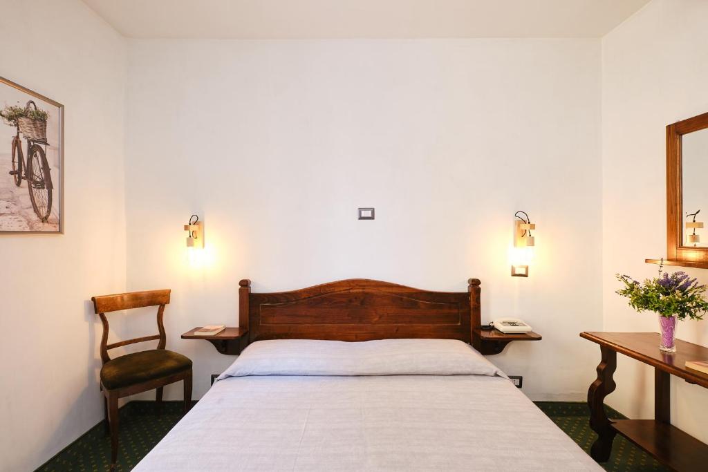Postel nebo postele na pokoji v ubytování Albergo Della Posta