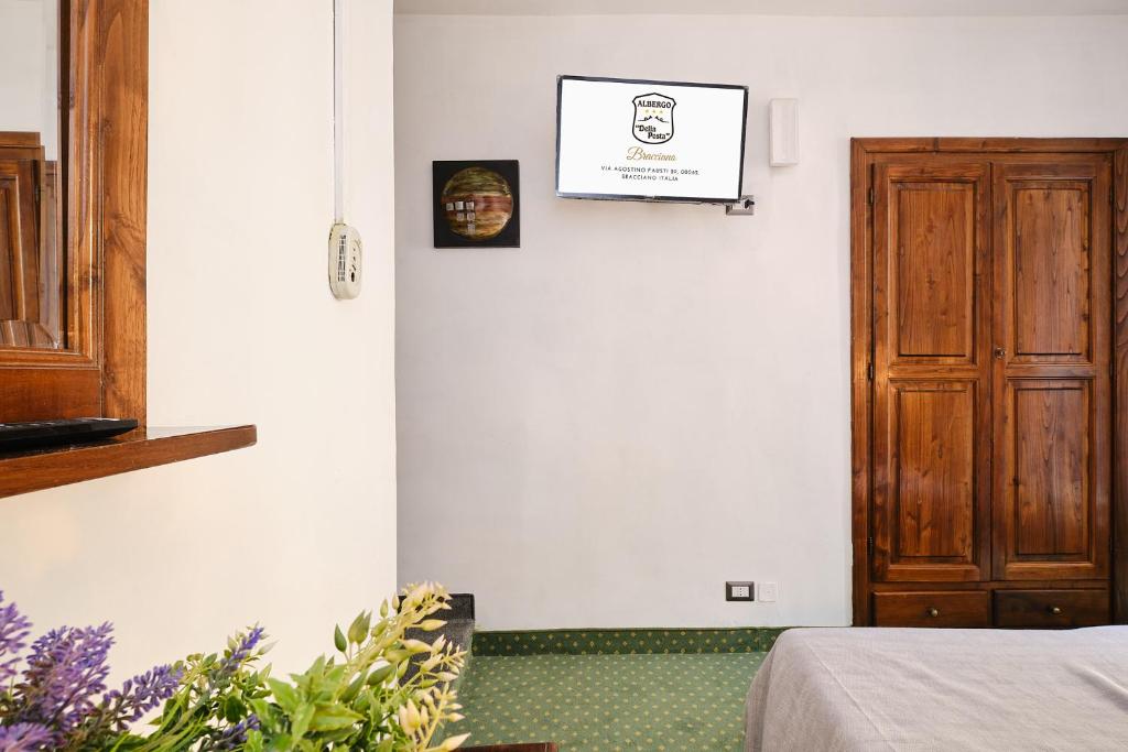 Postel nebo postele na pokoji v ubytování Albergo Della Posta