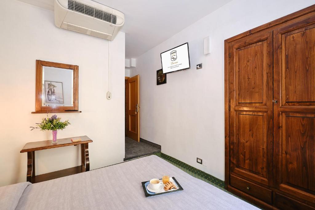 Postel nebo postele na pokoji v ubytování Albergo Della Posta