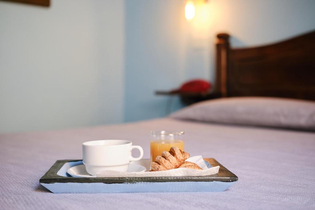 Postel nebo postele na pokoji v ubytování Albergo Della Posta