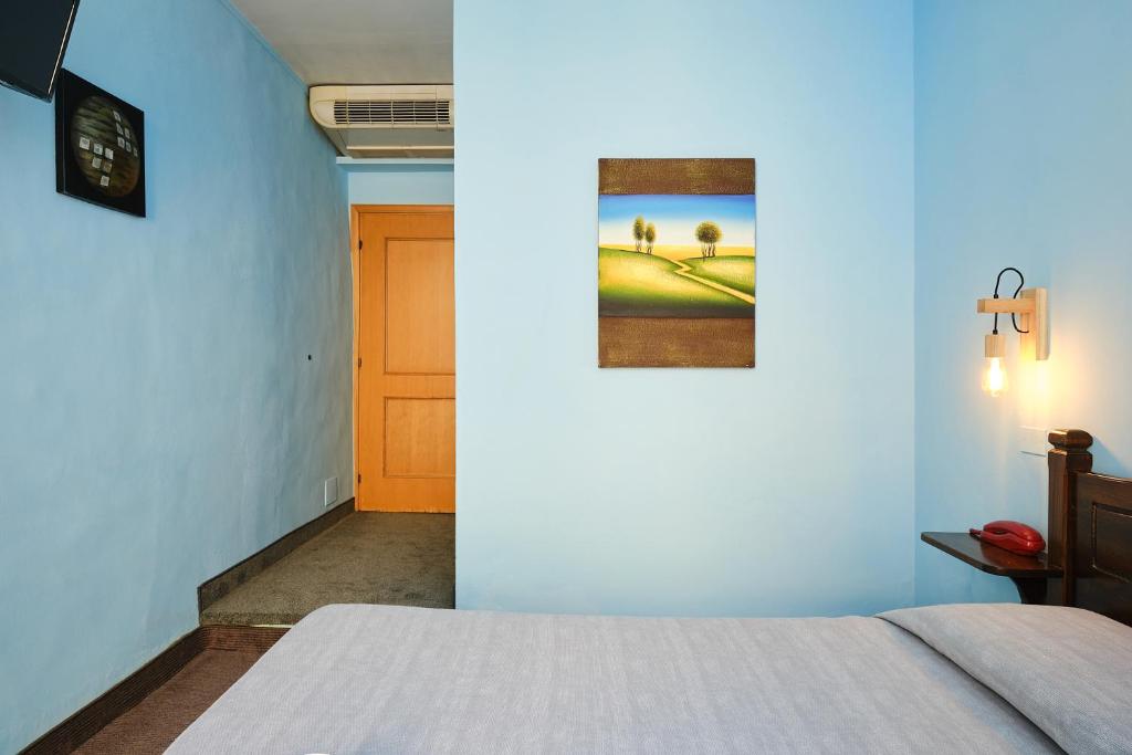 Postel nebo postele na pokoji v ubytování Albergo Della Posta