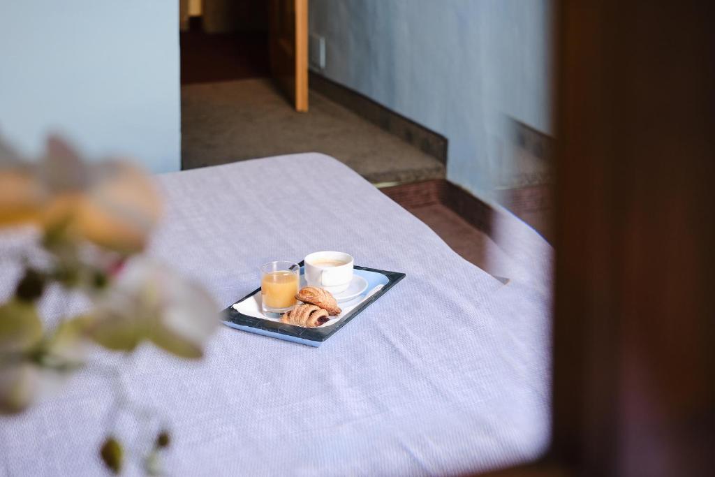 Postel nebo postele na pokoji v ubytování Albergo Della Posta
