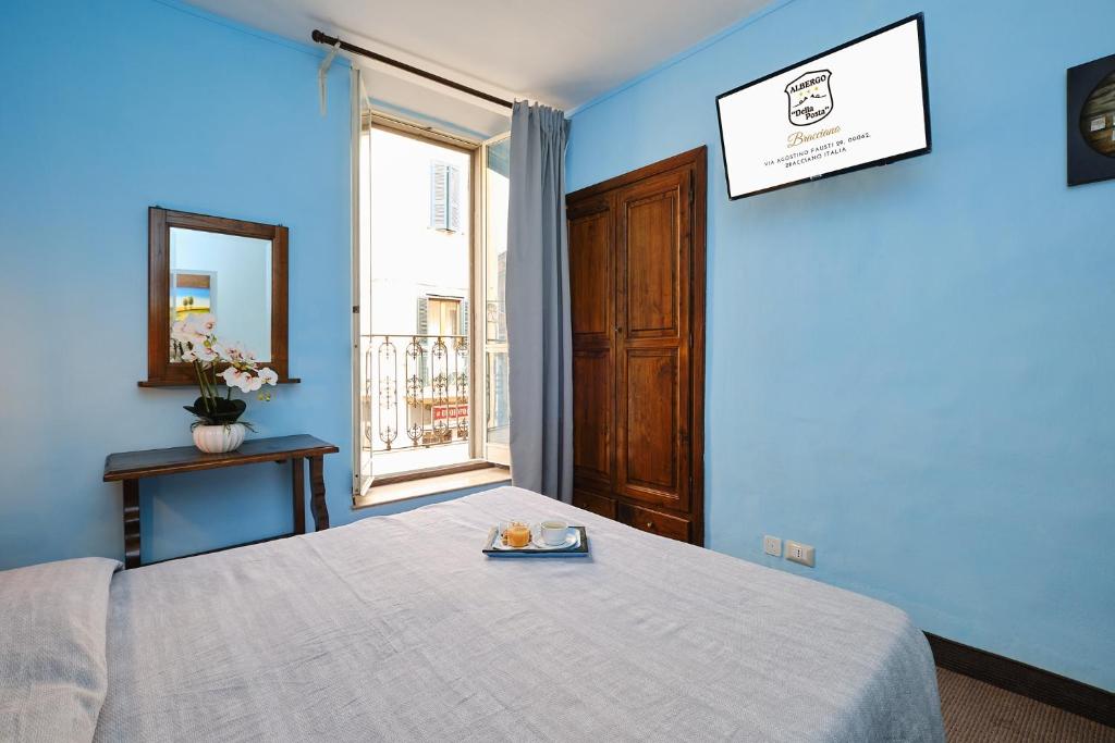 Postel nebo postele na pokoji v ubytování Albergo Della Posta