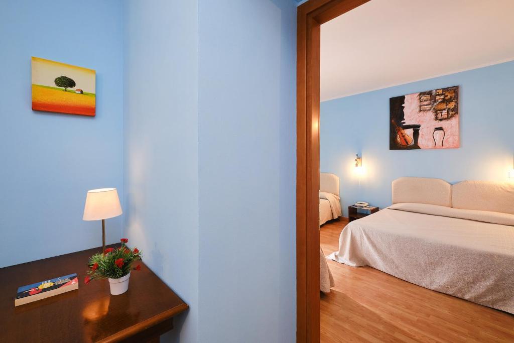 Postel nebo postele na pokoji v ubytování Albergo Della Posta