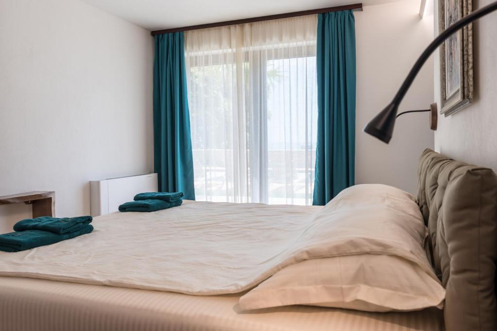 Postel nebo postele na pokoji v ubytování Balkida Residence - Balchik Villas