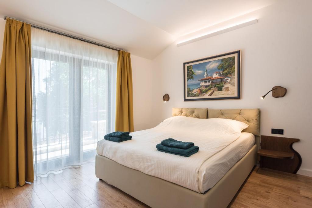 Postel nebo postele na pokoji v ubytování Balkida Residence - Balchik Villas