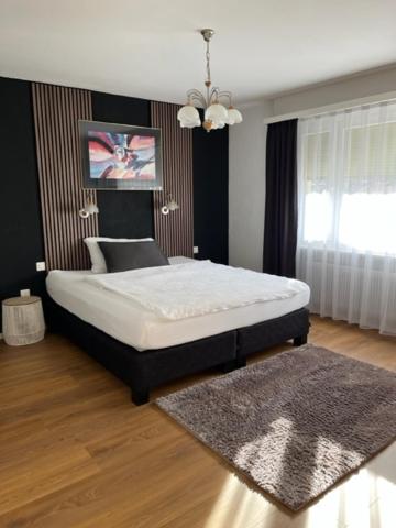 Postel nebo postele na pokoji v ubytování Hotel Europe Brig