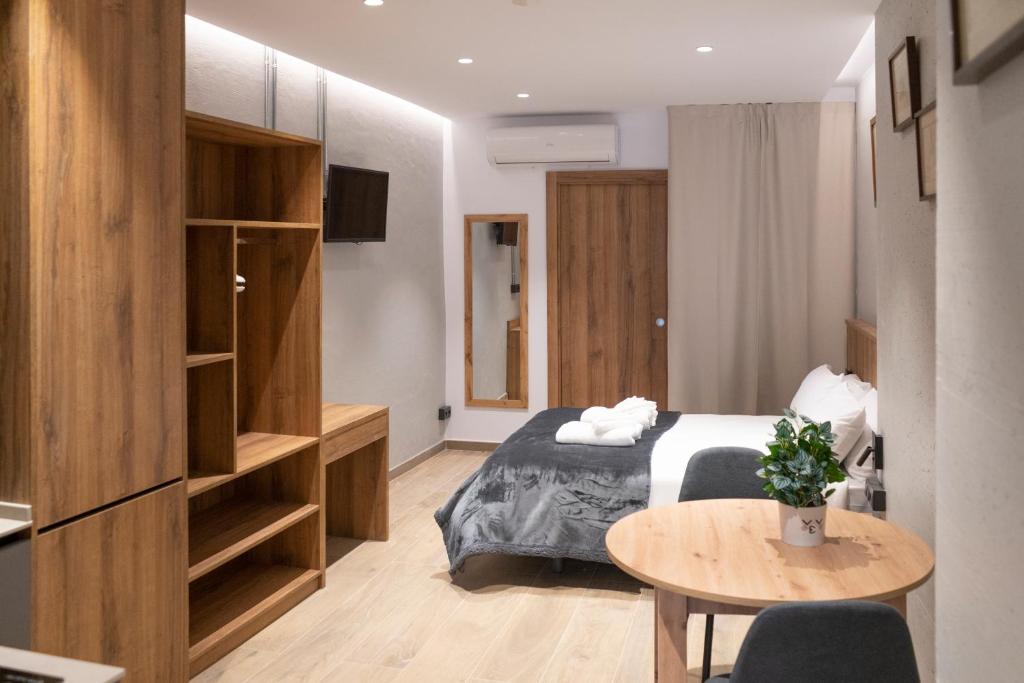 Ένα ή περισσότερα κρεβάτια σε δωμάτιο στο Monturiol Apartaments