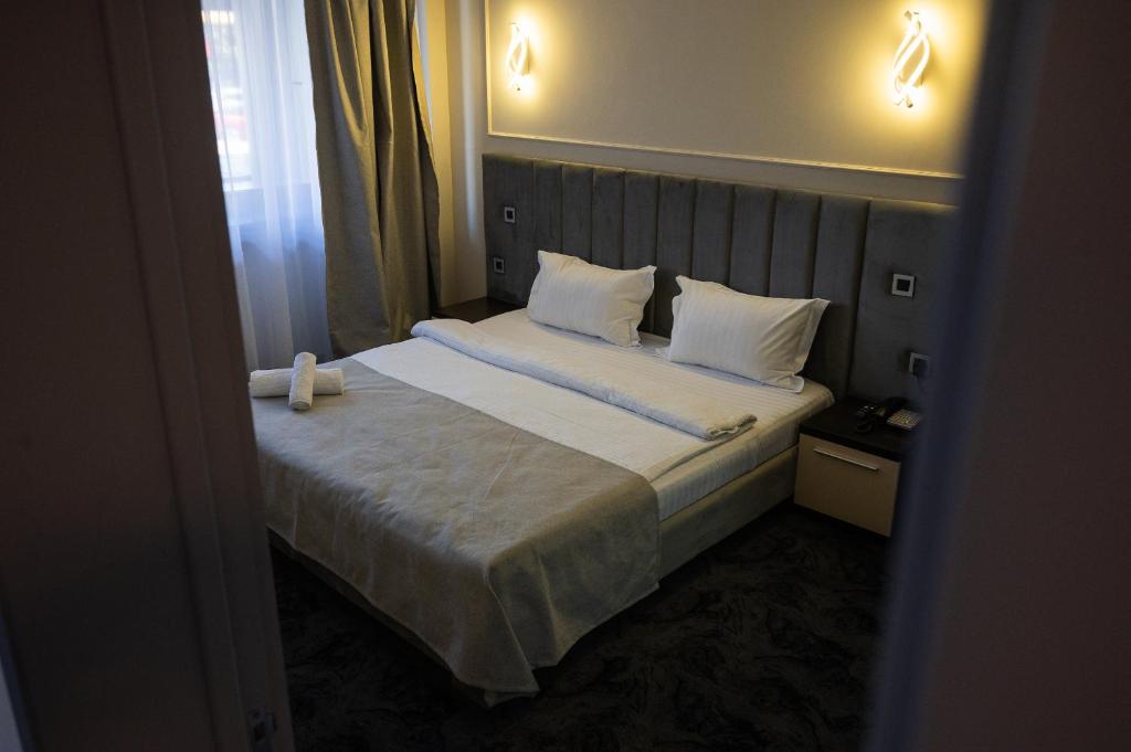 Postel nebo postele na pokoji v ubytování Black Tulip Hotel