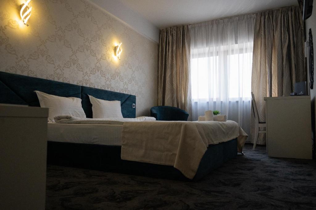 Postel nebo postele na pokoji v ubytování Black Tulip Hotel