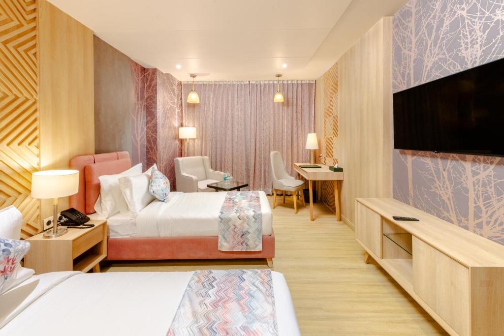 TV a/nebo společenská místnost v ubytování Signature Hotel