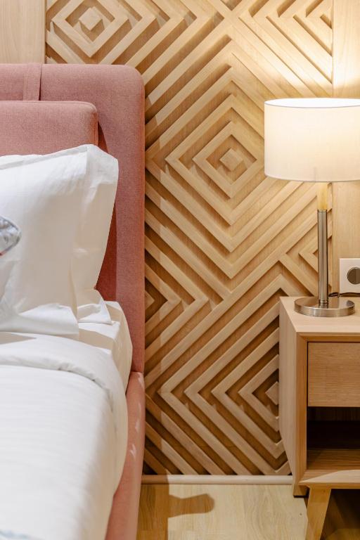 Postel nebo postele na pokoji v ubytování Signature Hotel