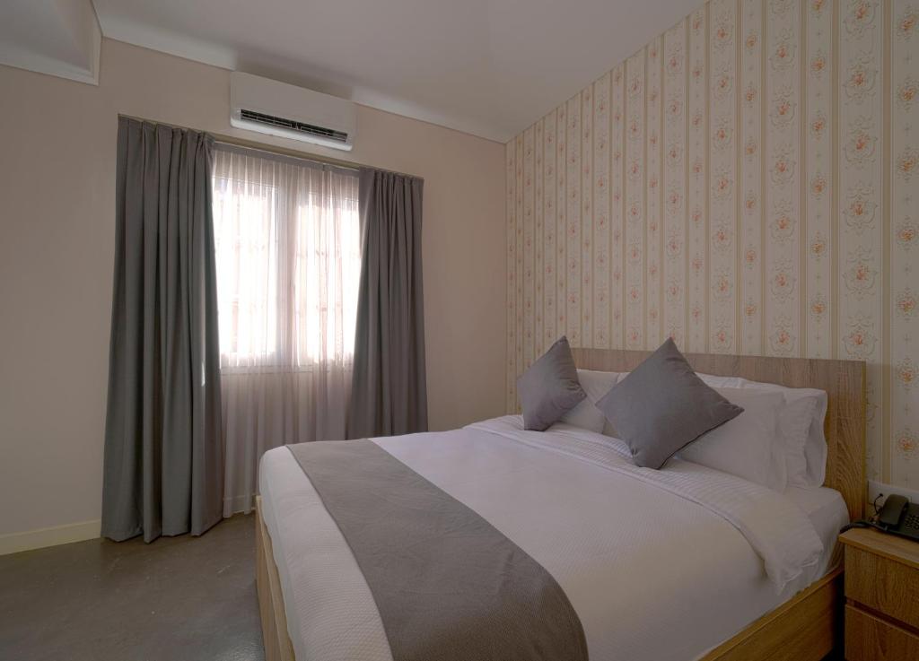 Postel nebo postele na pokoji v ubytování Comfy apart hotel