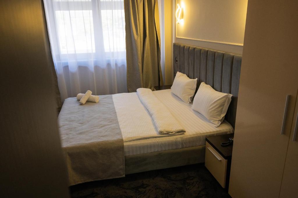 Postel nebo postele na pokoji v ubytování Black Tulip Hotel