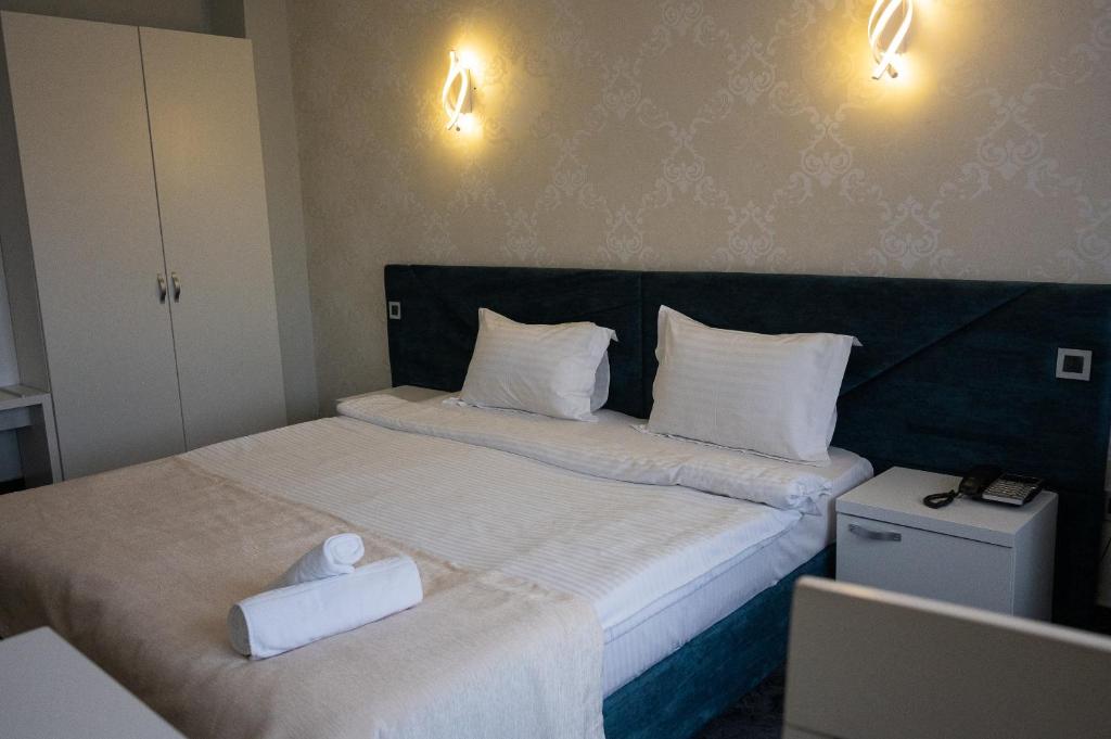 Postel nebo postele na pokoji v ubytování Black Tulip Hotel
