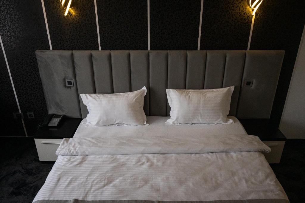 Postel nebo postele na pokoji v ubytování Black Tulip Hotel