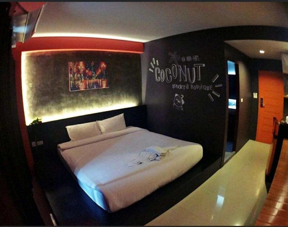 Postel nebo postele na pokoji v ubytování Coconut hotel