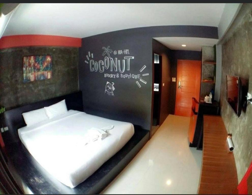 Postel nebo postele na pokoji v ubytování Coconut hotel