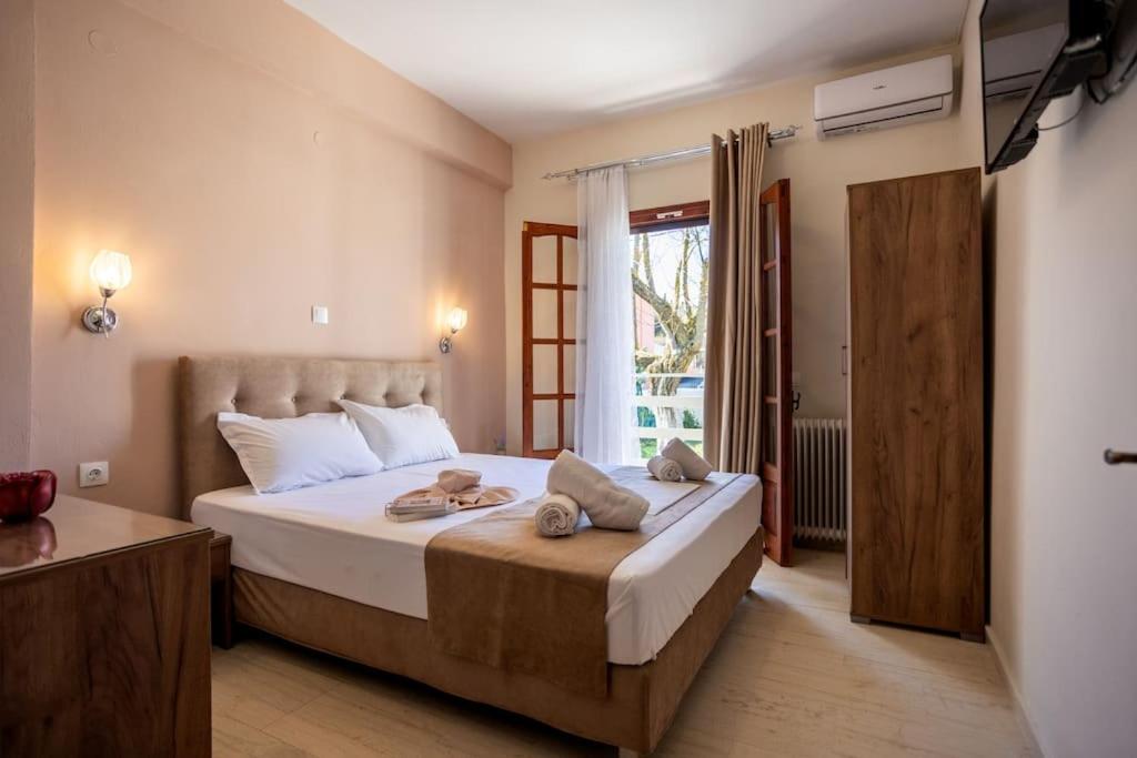 Ένα ή περισσότερα κρεβάτια σε δωμάτιο στο Villa Evridiki