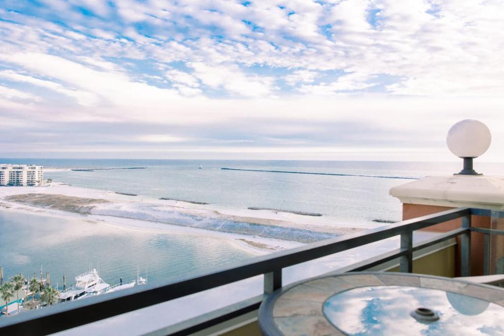 a balcony with a view of the ocean at Harborwalk Village Two Bedroom Vacation Rental in Destin