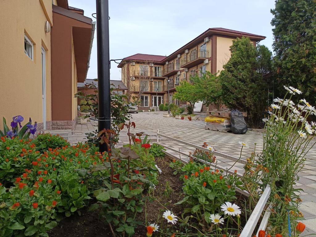 a garden with flowers in the middle of a street at Kherim 2 in Tuzla