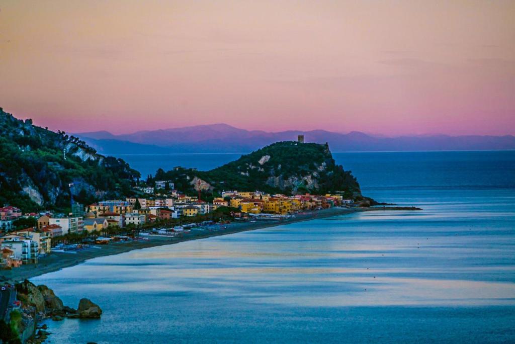 an island in the ocean with a town on a hill at Ariadimare guest house in Finale Ligure