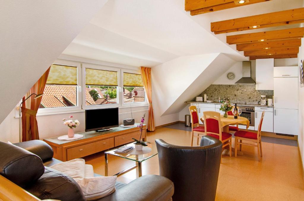 a living room with a couch and a table at Huus Nördernee 2 in Norderney